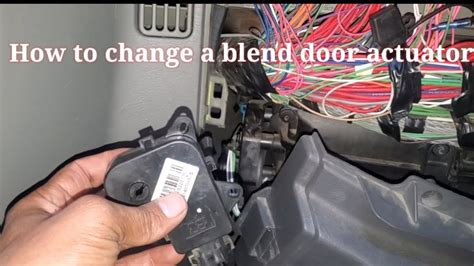 Disconnect the electrical connector. . Peterbilt 379 blend door actuator location